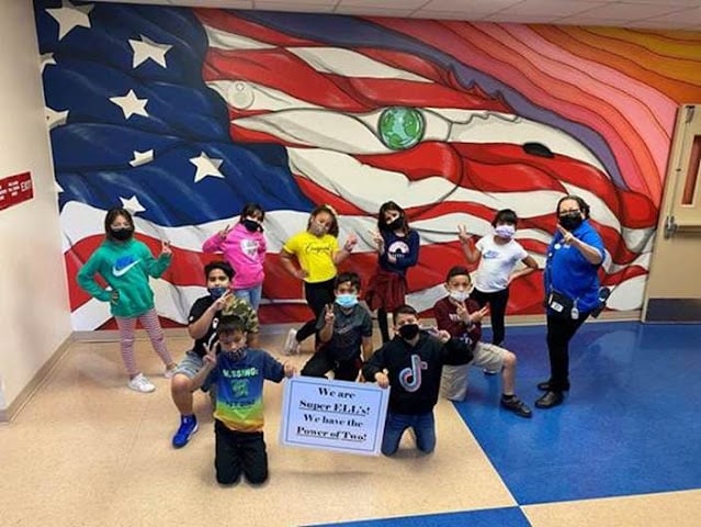 Elementary schools students put up two fingers for Mosaic by ACT SEL Super ELLS 